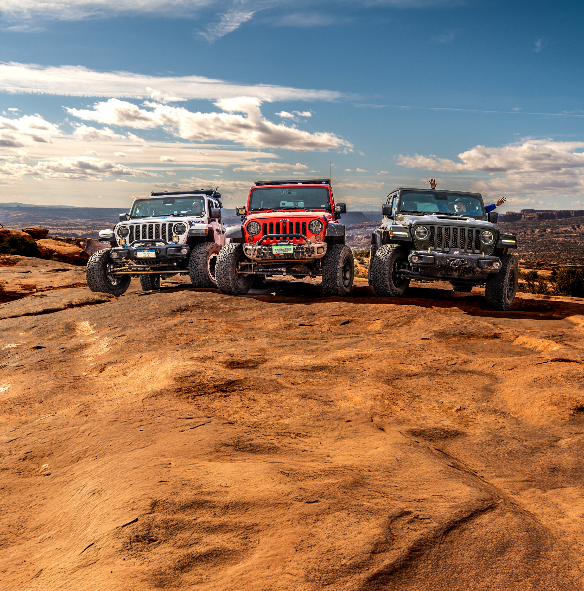 Image with 3 Jeeps on rocks